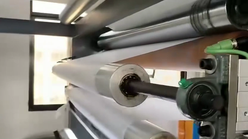 White web routed through parallel rollers and roller shafts