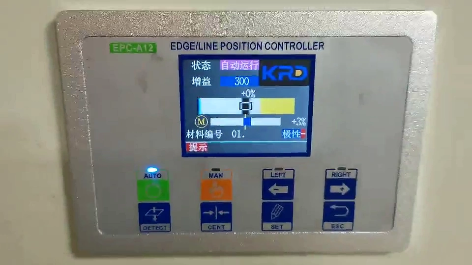 KRD EPC-A12 edge and line position controller installed on a cabinet beside the machine