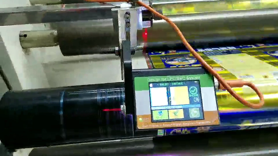 Sensor mounting bracket and local display positioned above a printed web on a roller
