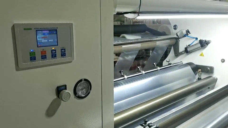 KRD controller cabinet alongside a reflective web routed through parallel rollers