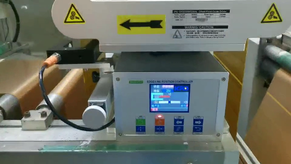 KRD edge and line position control panel mounted below the compact guide rollers